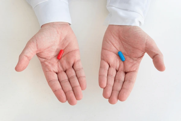 hand-taking-medicine-capsule-pills-600nw-2271730005